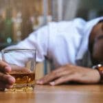 man passed out from binge and chronic drinking