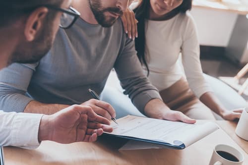 Couple looking over insurance paperwork