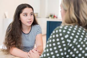 Daughter talking to mom about drinking