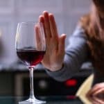 Woman saying no to wine