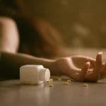 overdose on floor with pills