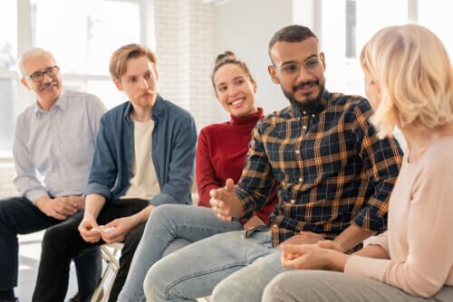 People sitting next to each other during therapy session