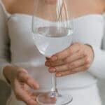 Bride with water at sober wedding