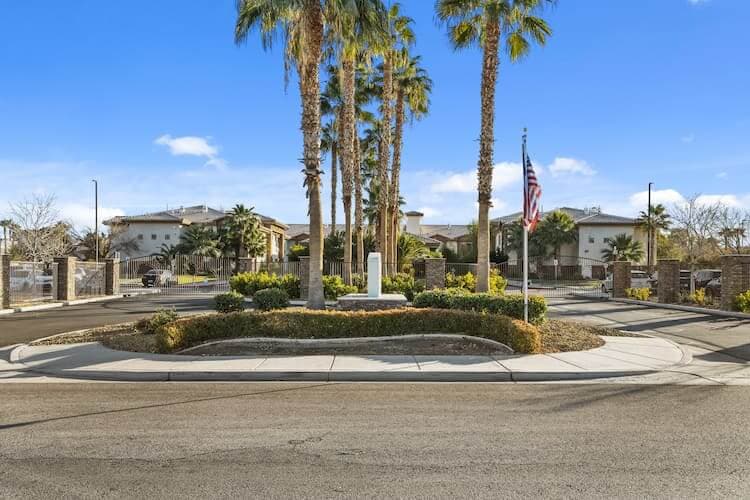 Driveway with palm trees in front of Desert Hope Treatment Center